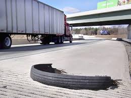 Shredded Tire "Gator" on the road in Flint Michigan