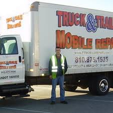 Tyler beside his truck