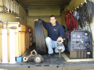 Tyler in the back of the Mobile Repair Truck